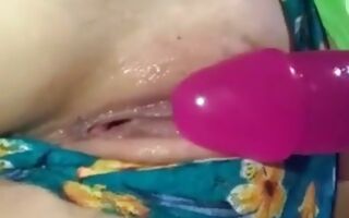 Teen brunette fucking her pussy with a dildo