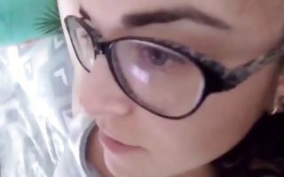 Pretty brunette amateur in glasses fingers her cunt in panties